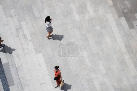 Photo for Top view crowd of people walks on a business street pedestrian in the city - Royalty Free Image
