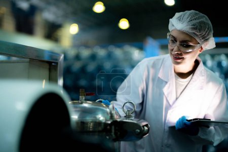 Photo for Scientist worker checking the quality of Reverse osmosis machine system at the industrial factory. Female worker recording data at the control panel with measure pressure for recycle portable plant. - Royalty Free Image