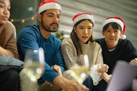 Photo for Close up face of asian young teen calling through screen tablet to friends. party of people celebrating by technology online communication. friend female and male celebrating christmas at home. - Royalty Free Image