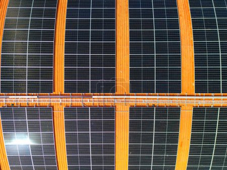 Photo for Top aerial view of solar roof system at the rooftop of factory warehouse. renewable energy of photovoltaic for reduce energy and carbon footprint. clean energy. solar panel and structure at building. - Royalty Free Image