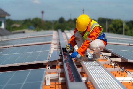 Photo for Worker Technicians are working to construct solar panels system on roof. Installing solar photovoltaic panel system. Alternative energy ecological concept. Renewable clean energy technology concept. - Royalty Free Image