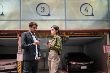 Photo for Professional salesperson woman selling cars to businessman buyer. Car Sales. Manager Giving suggestions to Businessman Buyer In garage parking Dealership Shop. Car dealer sales consultant. - Royalty Free Image