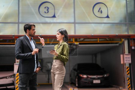 Photo for Professional salesperson woman selling cars to businessman buyer. Car Sales. Manager Giving suggestions to Businessman Buyer In garage parking Dealership Shop. Car dealer sales consultant. - Royalty Free Image