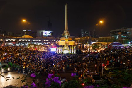 Photo for Bangkok, Thailand - January 13th, 2014: People's Alliance for Democracy, PAD, supporters gather and protest against Yingluck Shinawatra, the 28th Thai prime minister, at the Victory Monument. - Royalty Free Image