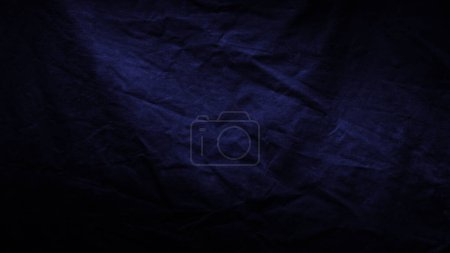 Abstract dark background. Silk satin fabric, Navy dark color, Elegant background with space for design, surface dark fabric texture background