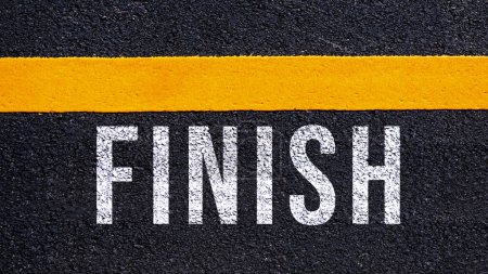 Photo for Finish text written and yellow line on the road in middle of the asphalt road, for business planning strategies and challenges, road to success concept, Finish word on street - Royalty Free Image