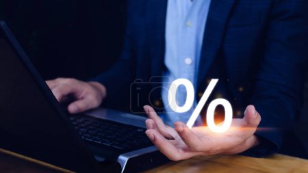 Photo for Businessman holding with percentage sign, monetary growth, interest rate increase, inflation concept, Interest rate financial and mortgage rates concept. - Royalty Free Image
