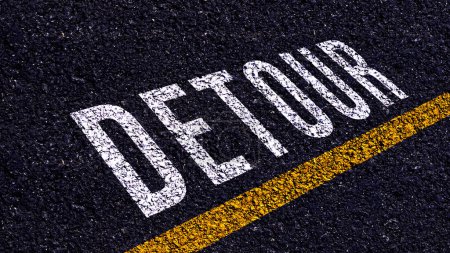 Photo for Detour written and yellow line on the road in middle of the asphalt road, Detour word on street. - Royalty Free Image
