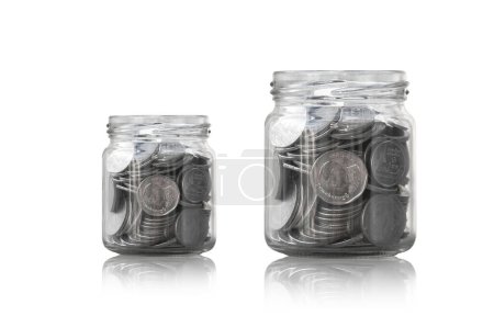 Photo for Coins in a glass jar against ,savings coins - Investment And Interest Concept saving money concept, growing money on piggy bank. isolated on white background - Royalty Free Image