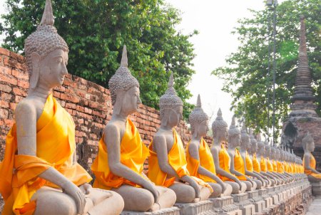 Photo for Buddha statues in at Wat Yai Chaimongkol in Ayutthaya Thailand, in Ayutthaya historical park, which is recognized as a unesco world heritage site - Royalty Free Image