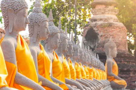 Photo for Buddha statues in at Wat Yai Chaimongkol in Ayutthaya Thailand, in Ayutthaya historical park, which is recognized as a unesco world heritage site - Royalty Free Image