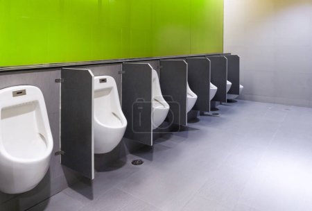 Photo for Men's room urinals discharge of waste from the body,men toilets - Royalty Free Image
