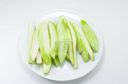 Photo for Mango split on white dish on white background - Royalty Free Image
