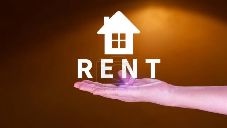 Photo for Realtor's hand puts with icon house and word RENT. Concept of renting housing, apartment, real estate. market of immobility, Property investment and house mortgage financial concept - Royalty Free Image