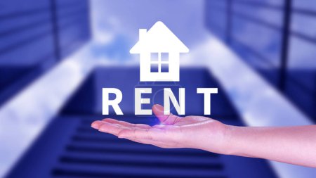 Realtor's hand puts with icon house and word RENT. Concept of renting housing, apartment, real estate. market of immobility, Property investment and house mortgage financial concept