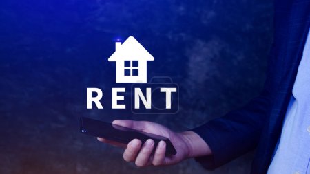 Photo for Realtor's hand puts with icon house and word RENT. Concept of renting housing, apartment, real estate. market of immobility, Property investment and house mortgage financial concept - Royalty Free Image