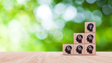Thinking skills for business leader and manager concept. creative, systematic thinking skill, wooden cube block with head human symbol and light bulb icon creative idea concept.