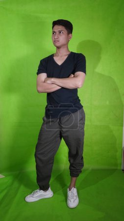 Handsome Asian Youth with Cool and Elegant Poses with Green Screan