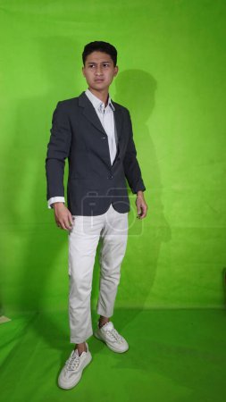 Handsome Asian Youth with Cool and Elegant Poses with Green Screan
