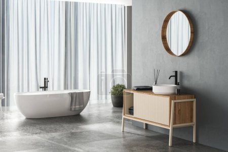 Téléchargez les photos : Intérieur de salle de bain moderne avec fond bleu, sol en béton, baignoire blanche, douche et lavabo, vue latérale. Salle de bain minimaliste avec mobilier moderne. rendu 3D - en image libre de droit