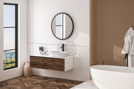 Foto de Moderno cuarto de baño interior con paredes beige, lavabo blanco con espejo oval, bañera y suelo de parquet. Minimalista baño luminoso con muebles modernos. Visualización lateral.3D - Imagen libre de derechos
