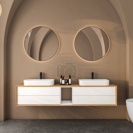 Foto de Moderno interior de baño de mediados de siglo y minimalista, concepto de decoración beige, gabinete de baño blanco moderno, lavabo blanco doble, inodoro, bidet, bañera con pared beige y piso de hormigón. renderizado 3d - Imagen libre de derechos
