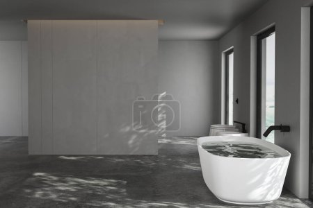 Foto de Un moderno cuarto de baño con bañera blanca, paredes grises y adecuado para mostrar armarios de baño, con suelo de hormigón. Perfecto para maquetas. Renderizado 3D - Imagen libre de derechos