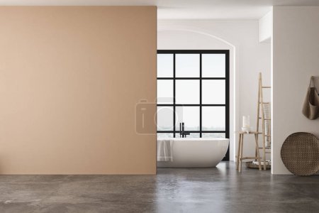 Une salle de bain avec baignoire blanche, murs beige et blanc, sol en béton, et équipé d'accessoires de salle de bains et serviettes, adapté pour mettre en valeur les armoires de salle de bains. Parfait pour les maquettes. rendu 3D