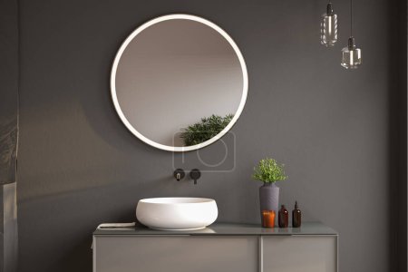 Configuración de baño elegante con dispensadores de jabón, toallas, planta, espejo de marco negro