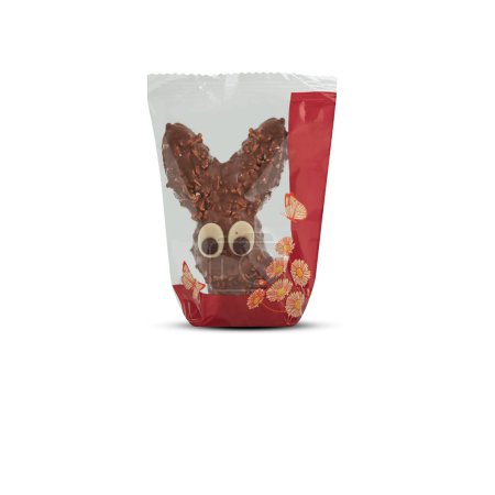Foto de Conejo en forma de conejo chocolates en bolsa de plástico con corte aislado sobre fondo blanco tienen camino de recorte - Imagen libre de derechos