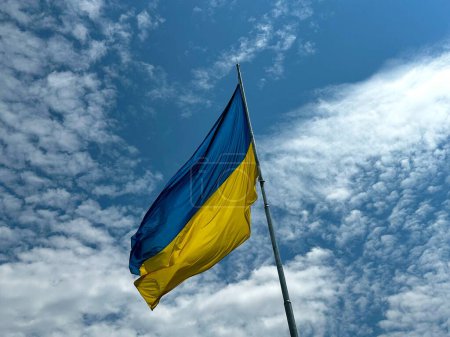 Photo for National flag of Ukraine. Slow motion of a large Ukrainian flag waving in the sky. Blue-yellow national symbol of Ukraine. The concept of peace and support for Ukraine against Russian aggression and war - Royalty Free Image