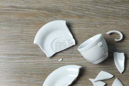 Photo for White cup broken on the table - Royalty Free Image