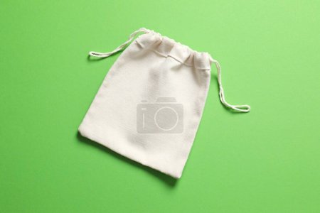 Small eco sack on color background. Top view.