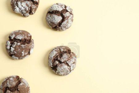 Delicious brownie cookies on color background