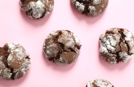 Delicious brownie cookies on a color background 