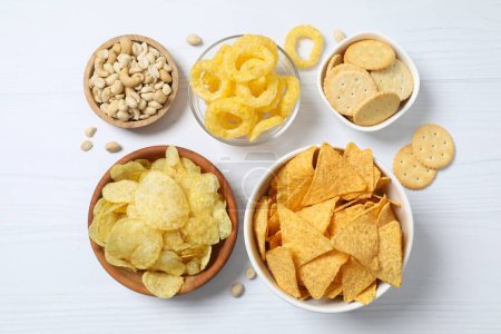Various unhealthy snacks on white background