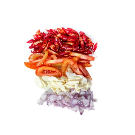 chopped chili , tomato , onion and garlic, prepped fresh vegetables isolated on white background
