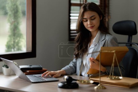 Photo for Lawyer business woman working or reading agreement contract in office workplace for consultant lawyer concept. - Royalty Free Image