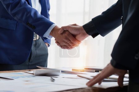 Photo for Business people handshake. Successful businessmen handshaking after good deal. Finishing up meeting concept. - Royalty Free Image