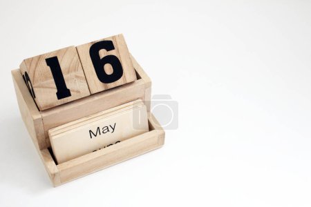 Photo for Wooden perpetual calendar showing the 16th of May - Royalty Free Image