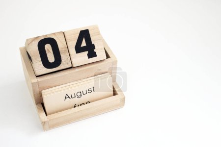 Photo for Wooden perpetual calendar showing the 4th of August - Royalty Free Image
