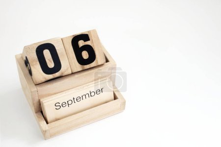 Photo for Wooden perpetual calendar showing the 6th of September - Royalty Free Image