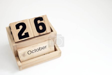 Photo for Wooden perpetual calendar showing the 26th of October - Royalty Free Image