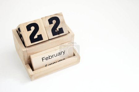 Photo for Wooden perpetual calendar showing the 22nd of February - Royalty Free Image