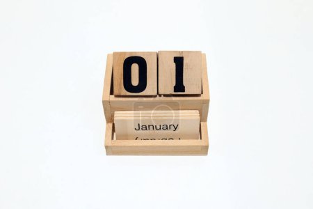 Photo for Close up of a wooden perpetual calendar showing the 1st of January. Shot close up isolated on a white background - Royalty Free Image