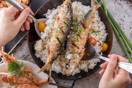 Photo for Crispy Delight: Deep Fried Fish over Fluffy White Steamed Rice in 4K Close-Up - Royalty Free Image