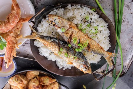 Photo for Crispy Delight: Deep Fried Fish over Fluffy White Steamed Rice in 4K Close-Up - Royalty Free Image