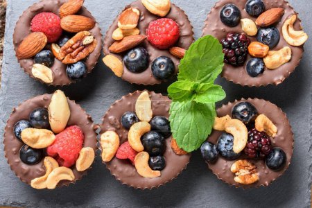 Photo for Delectable Close-Up of Homemade Chocolate Fruit and Nut Cups, Crafted with Love in Stunning 4K Resolution - Royalty Free Image