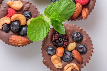 Photo for Delectable Close-Up of Homemade Chocolate Fruit and Nut Cups, Crafted with Love in Stunning 4K Resolution - Royalty Free Image