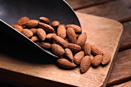 Savory Almonds in Spice Mix: Close-Up on Wooden Surface in 4K